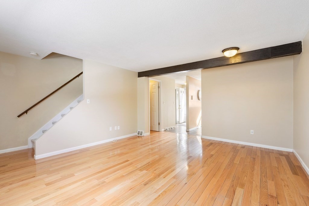 20 Hemlock Circle, Unit 20 Millis, MA 02054 - Photo 3 of 27 a view of an empty room with wooden floor