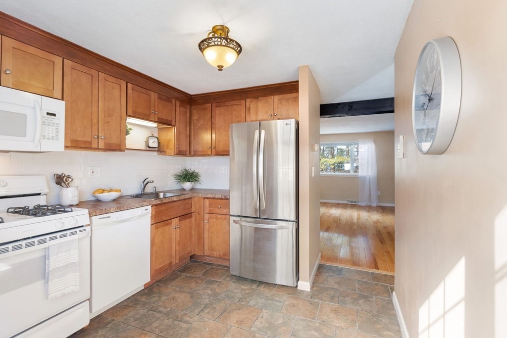 20 Hemlock Circle, Unit 20 Millis, MA 02054 - Photo 7 of 27 a kitchen with a refrigerator sink and stove