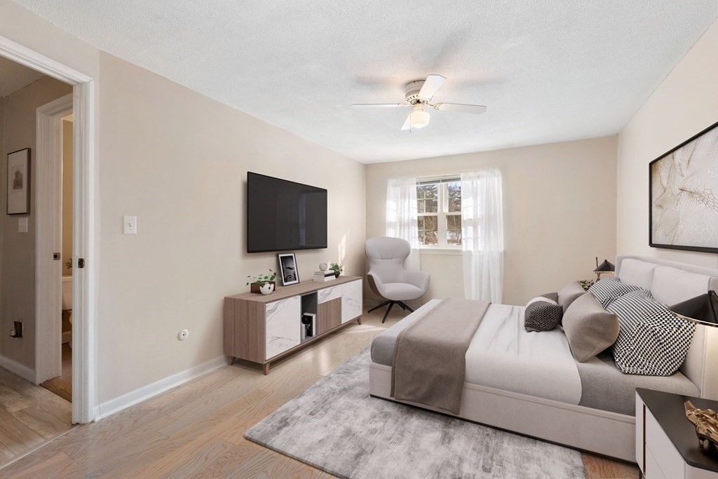 20 Hemlock Circle, Unit 20 Millis, MA 02054 - Photo 10 of 27 a living room with furniture and a flat screen tv