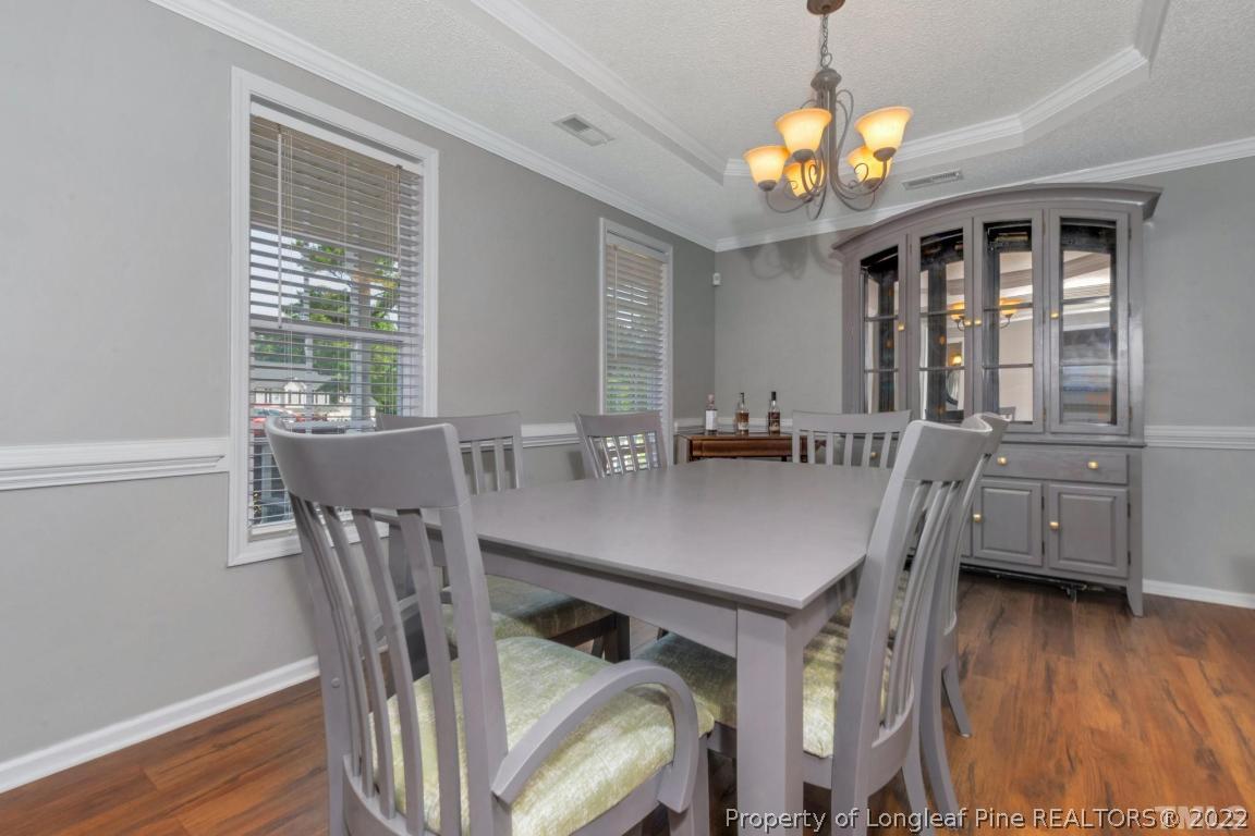 226 Linden Road Cameron, NC 28326 - Photo 18 of 36 a view of a dining room with furniture window and wooden floor