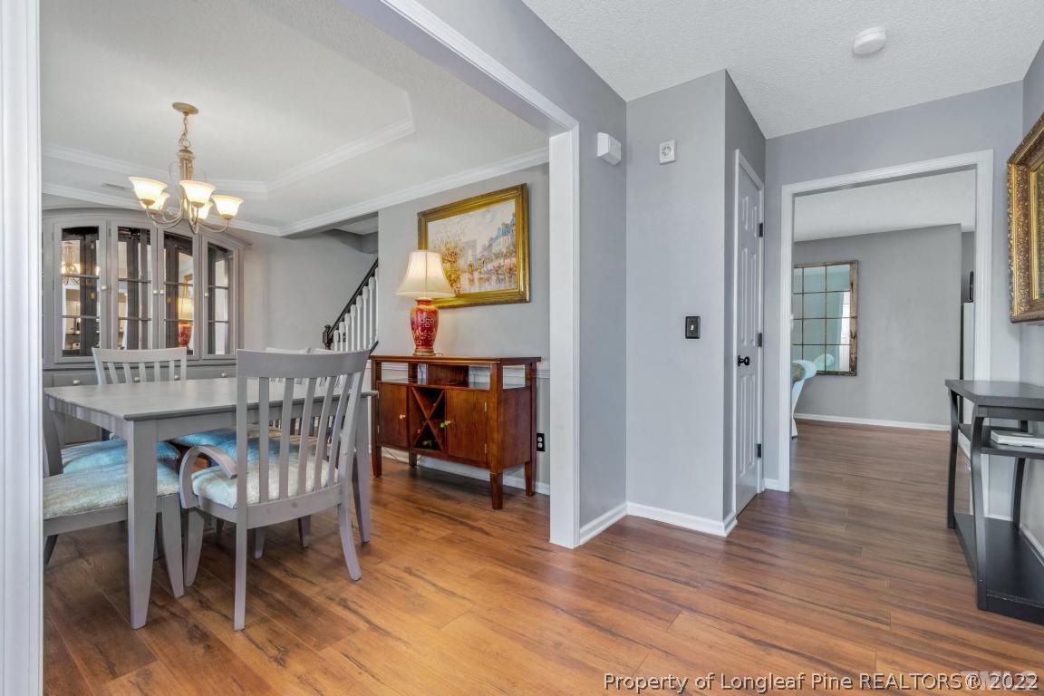 226 Linden Road Cameron, NC 28326 - Photo 19 of 36 a view of a livingroom kitchen and dinning room with wooden floor