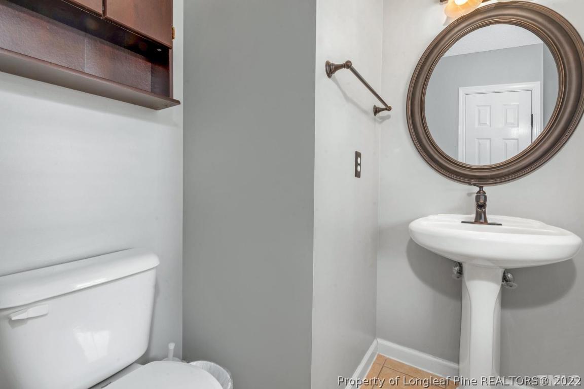 226 Linden Road Cameron, NC 28326 - Photo 20 of 36 a bathroom with a toilet and a sink