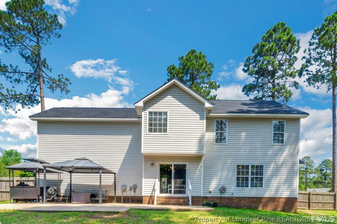 226 Linden Road Cameron, NC 28326 - Photo 2 of 36 a front view of a house with garden