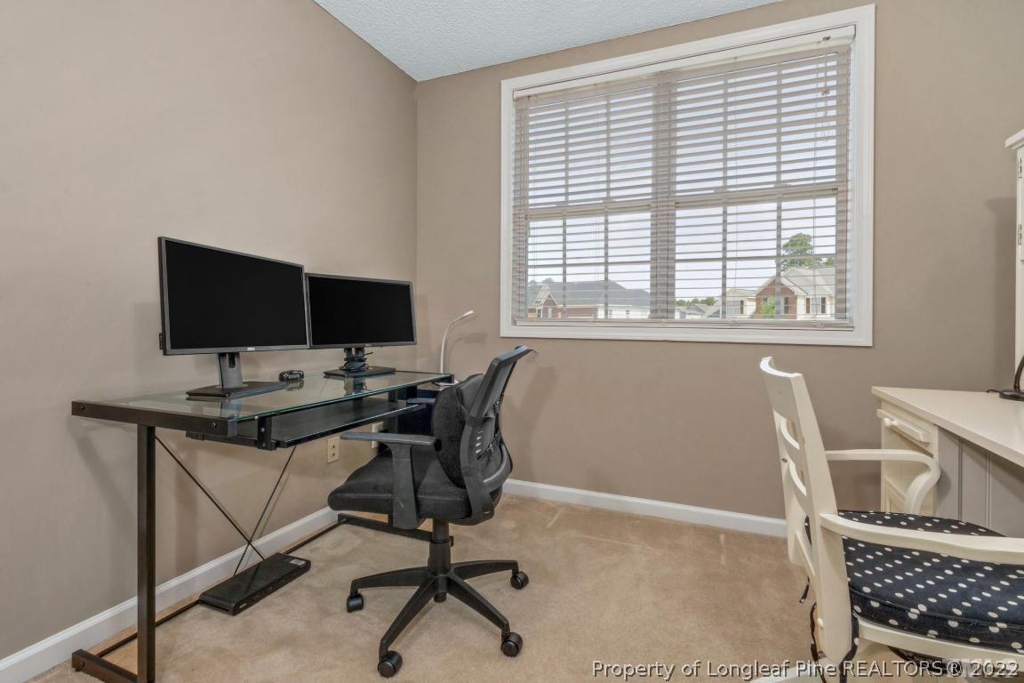 226 Linden Road Cameron, NC 28326 - Photo 26 of 36 a view of a workspace with furniture and a window