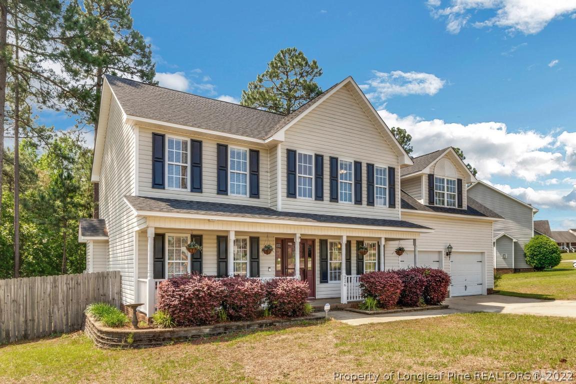 226 Linden Road Cameron, NC 28326 - Photo 5 of 36 a front view of a house with swimming pool and glass windows