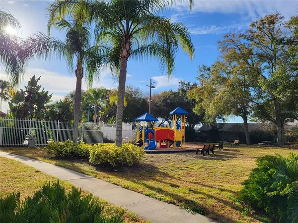 a view of a wooden deck with a yard