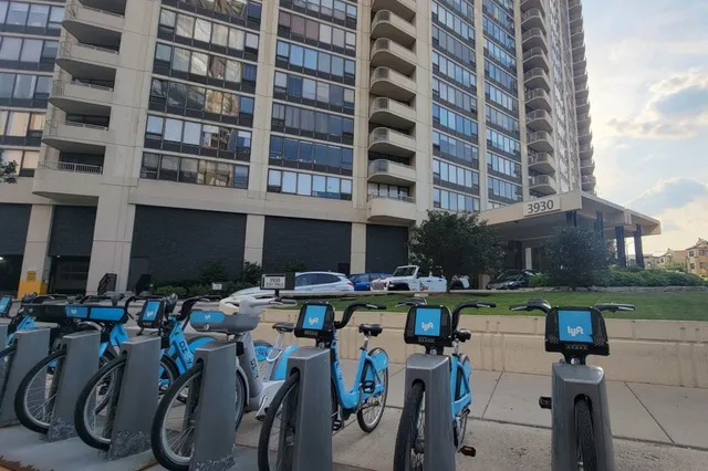 a group of people sitting in front of building