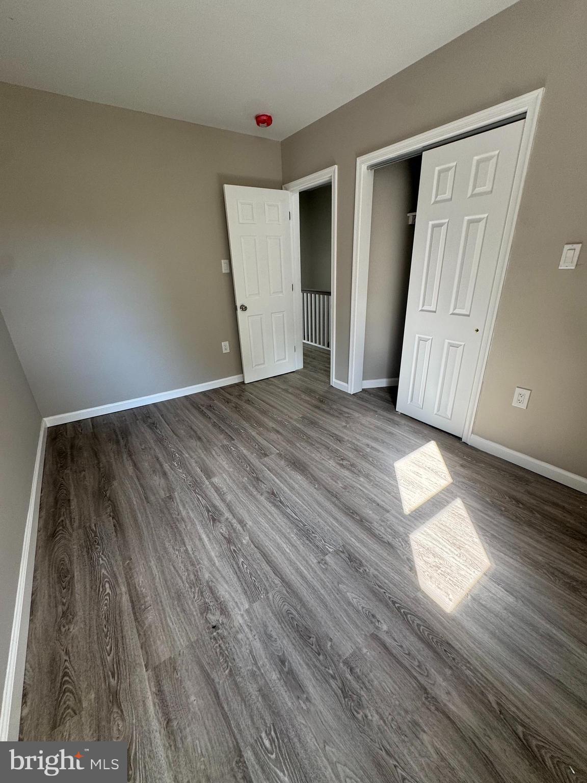 6018 Ross Street Philadelphia, PA 19144 - Photo 11 of 14 a view of empty room with wooden floor and fan