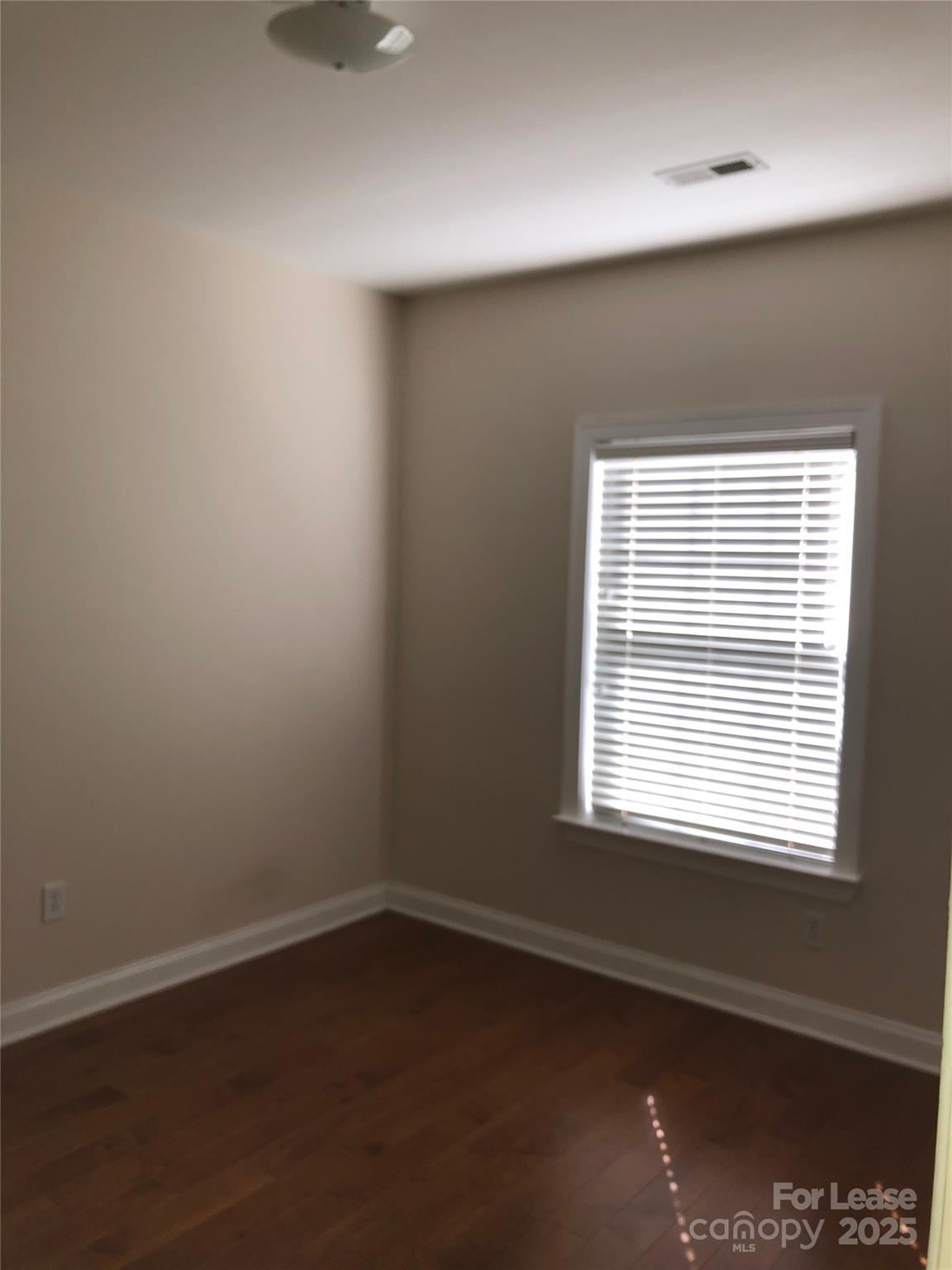 21253 Hickory Street Cornelius, NC 28031 - Photo 15 of 17 an empty room with a window
