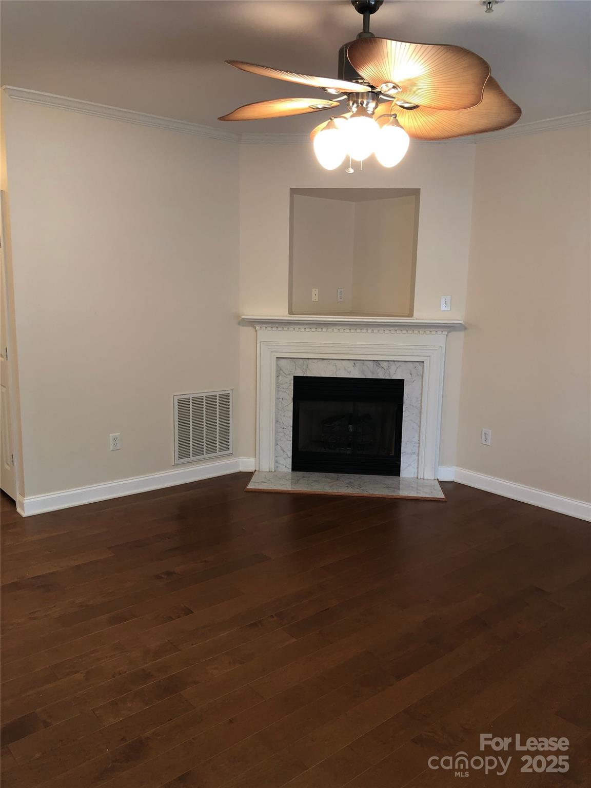 21253 Hickory Street Cornelius, NC 28031 - Photo 2 of 17 a view of a livingroom with a fireplace a chandelier fan and a fireplace