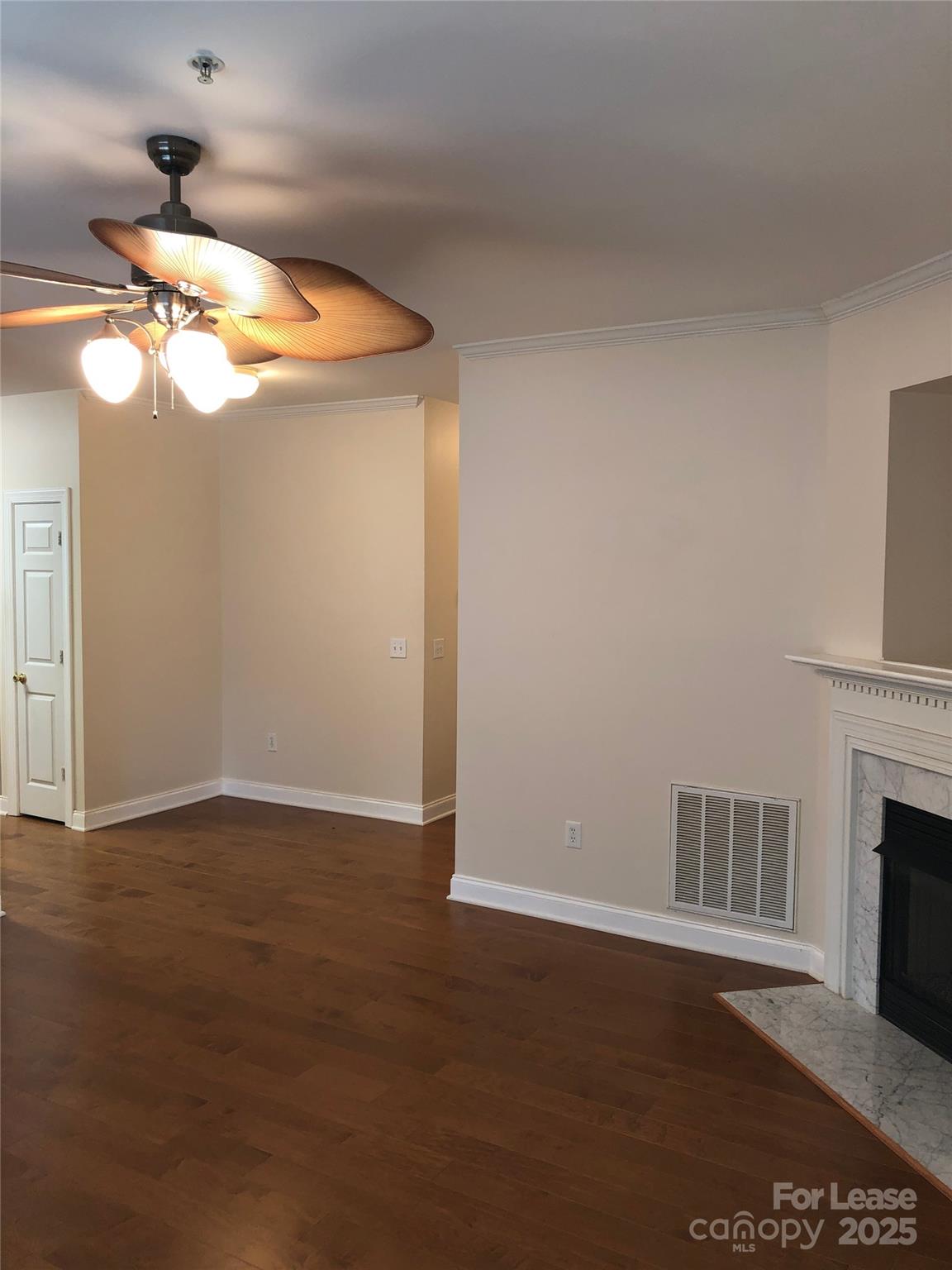 21253 Hickory Street Cornelius, NC 28031 - Photo 3 of 17 a view of empty room with wooden floor