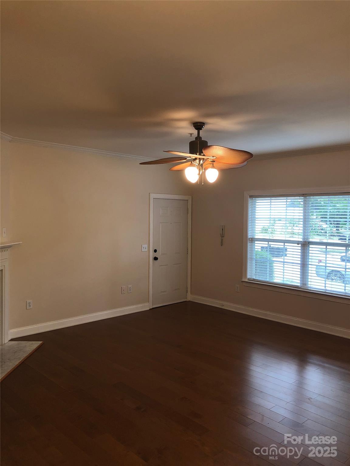 21253 Hickory Street Cornelius, NC 28031 - Photo 8 of 17 a view of an empty room with wooden floor and a window