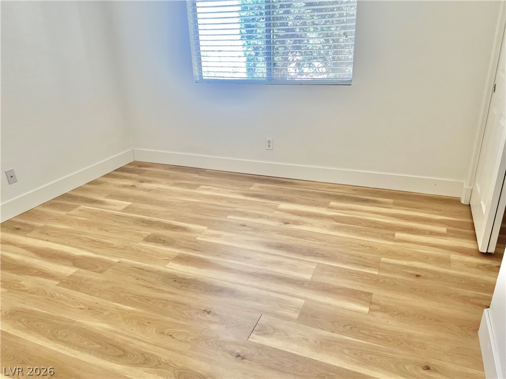 9708 Ridge Creek Place Las Vegas, NV 89134 - Photo 20 of 34 2nd Bedroom. Luminous room featuring resilient lvp flooring and a well-lit window.