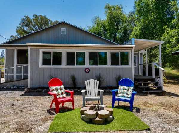 a front view of a house with outdoor seating yard