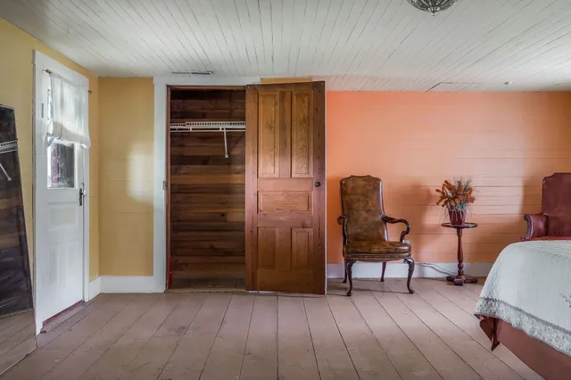 a bedroom with bed and window