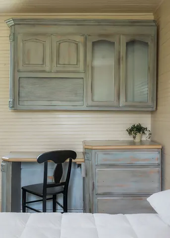 a view of a livingroom with wooden floor and a fireplace