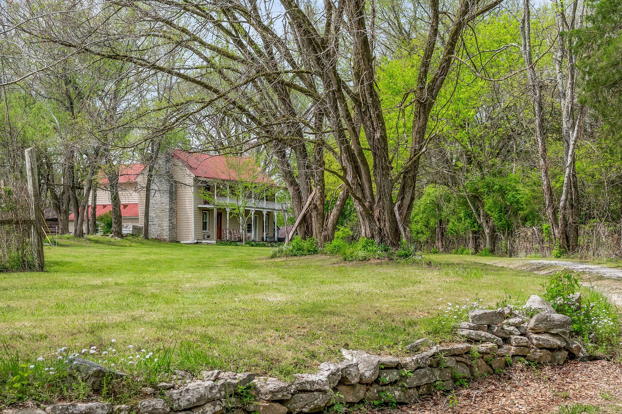 134 Opossum Hollow Road Watertown, TN 37184 - Photo 3 of 41 a backyard of a house with lots of green space and fountain