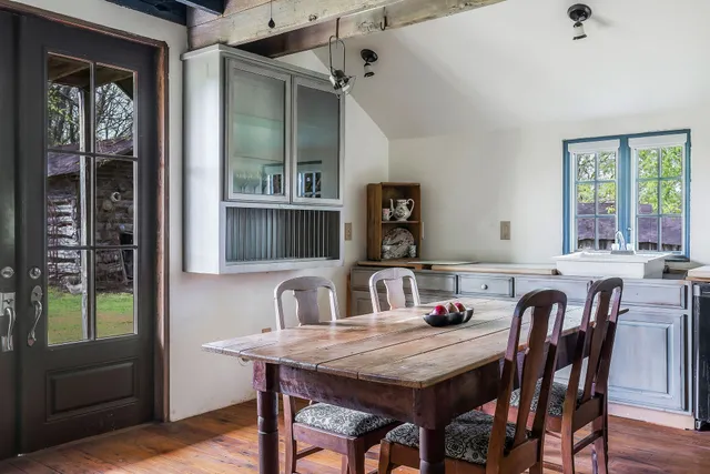 a dining room with furniture and window