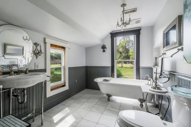 a living room with furniture a window and a dining table