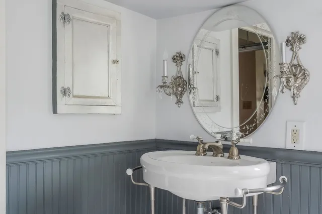 a bathroom with a bathtub and a sink