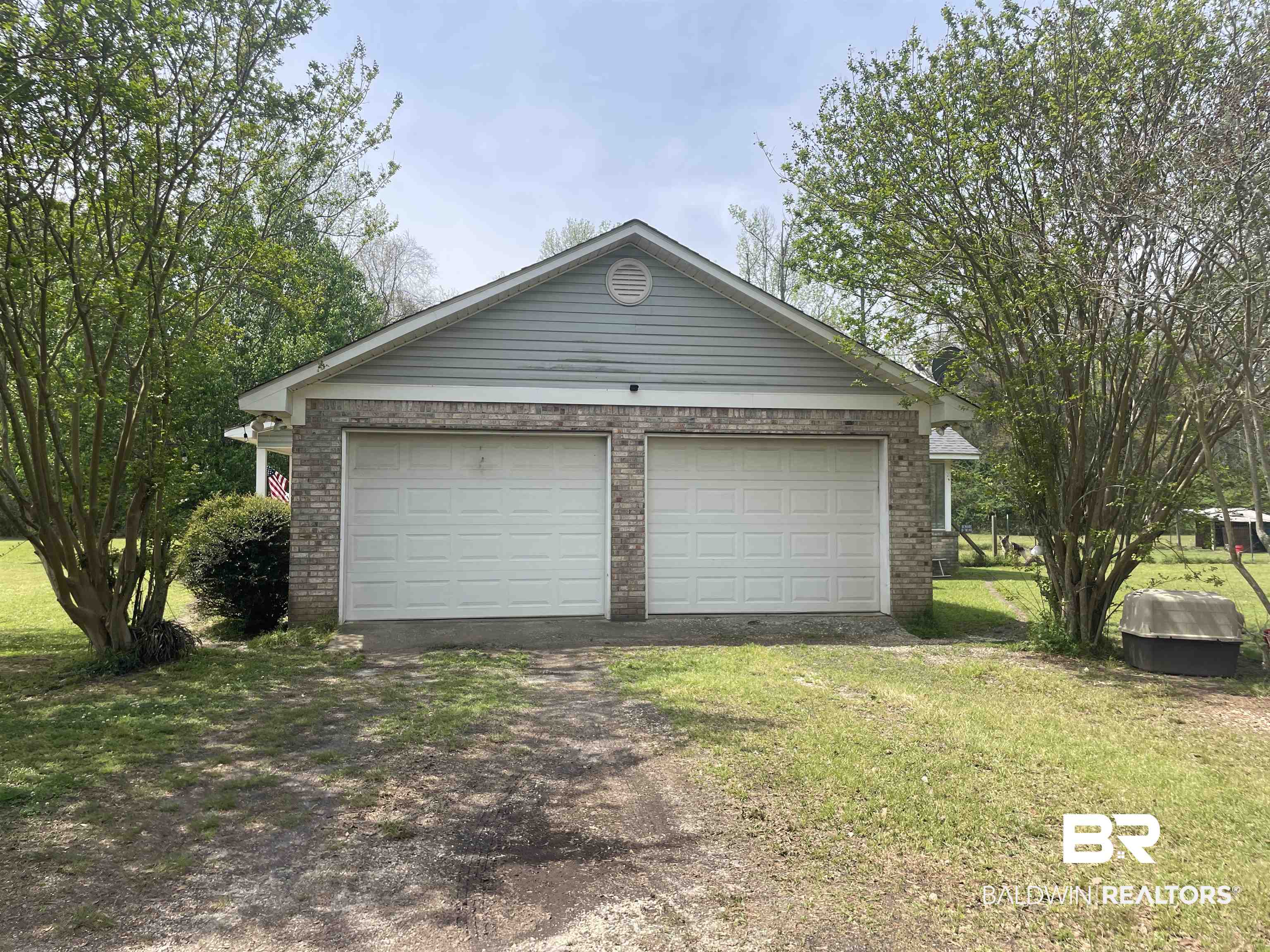 739 Smithfield Road Atmore, AL 36502 - Photo 13 of 18 Garage featuring driveway