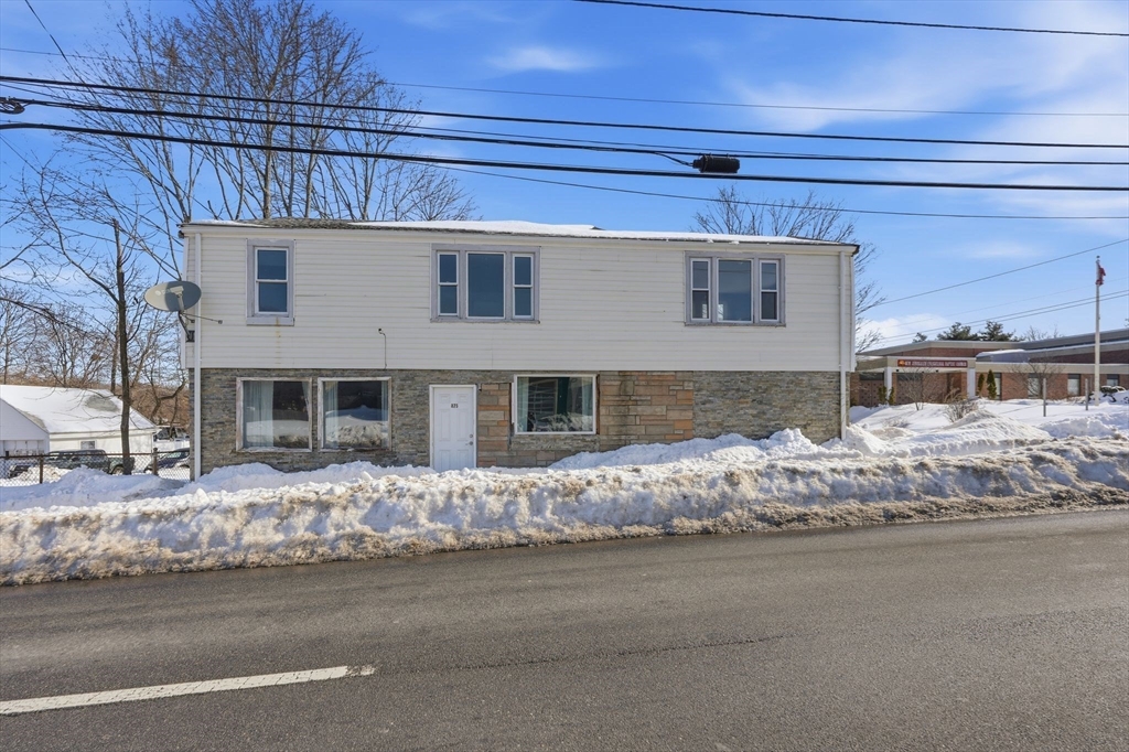 875 North Main Street Randolph, MA 02368 - Photo 1 of 42 a front view of a house with a yard