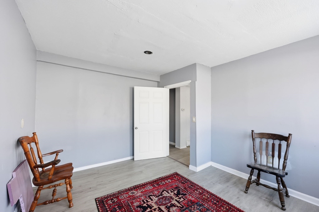 875 North Main Street Randolph, MA 02368 - Photo 12 of 42 a view of a room with furniture and wooden floor