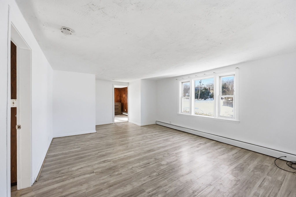 875 North Main Street Randolph, MA 02368 - Photo 24 of 42 a view of an empty room with wooden floor and a window