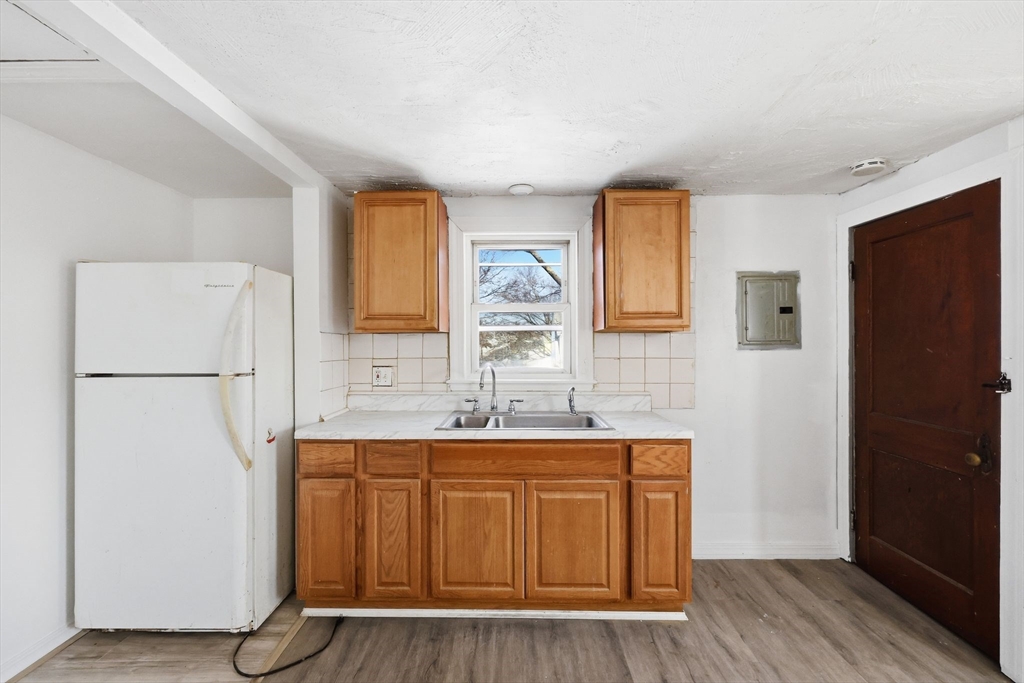 875 North Main Street Randolph, MA 02368 - Photo 31 of 42 a room with a refrigerator a washer and dryer