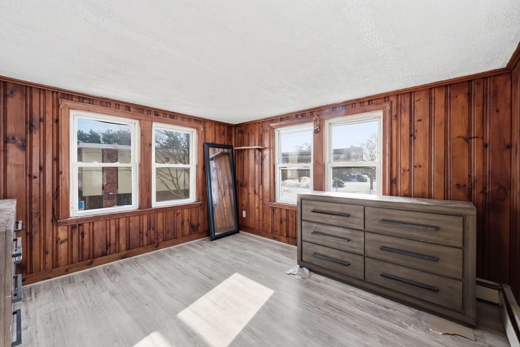 875 North Main Street Randolph, MA 02368 - Photo 32 of 42 wooden floor in an empty room with a window