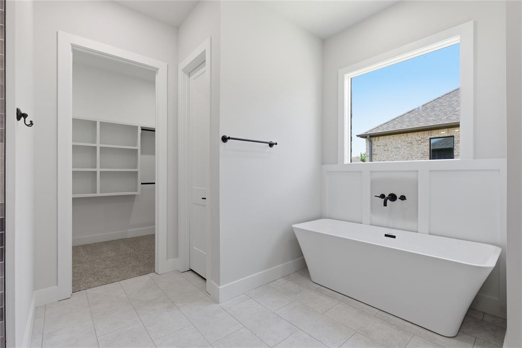 713 Anne Road Van Alstyne, TX 75495 - Photo 12 of 29 Freestanding soaking tub with wall-mounted matte black fixtures