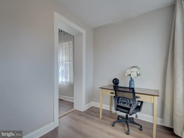 a workspace with furniture and a window