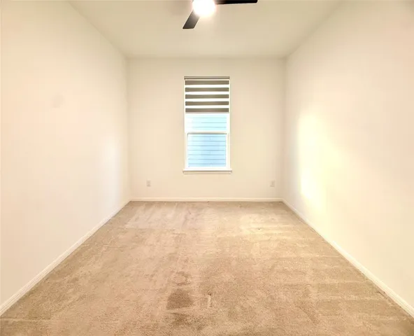 a bathroom with a sink a toilet a mirror and shower