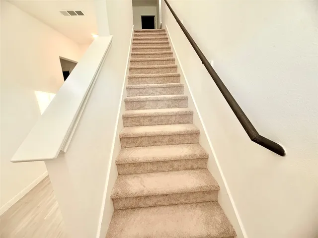 an empty room with view of ceiling fan