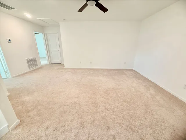 a view of a big room with carpet