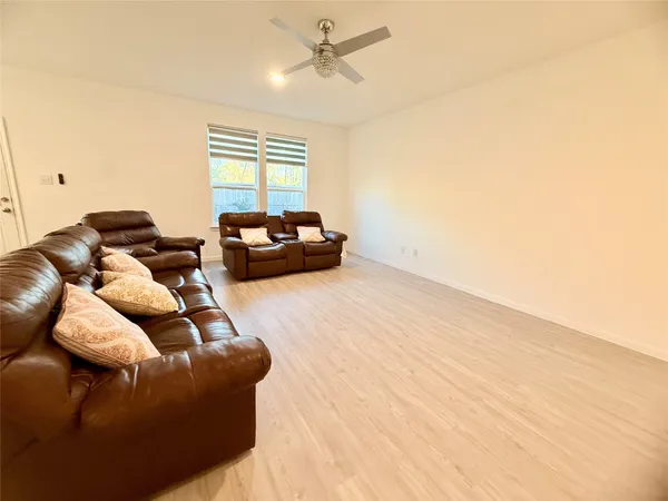 a kitchen with stainless steel appliances granite countertop a refrigerator a sink a stove a microwave and island