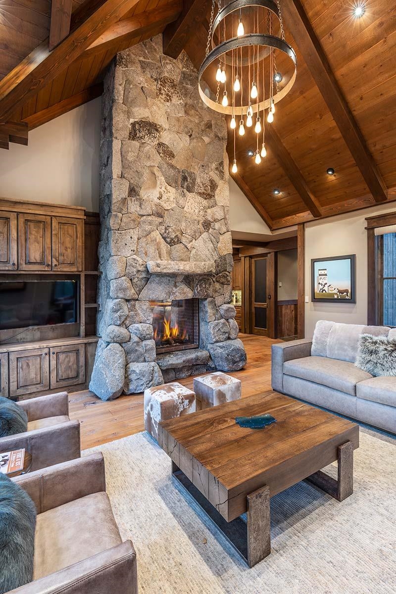 10285 Olana Drive Truckee, CA 96161 - Photo 8 of 21 a living room with furniture a flat screen tv and a fireplace