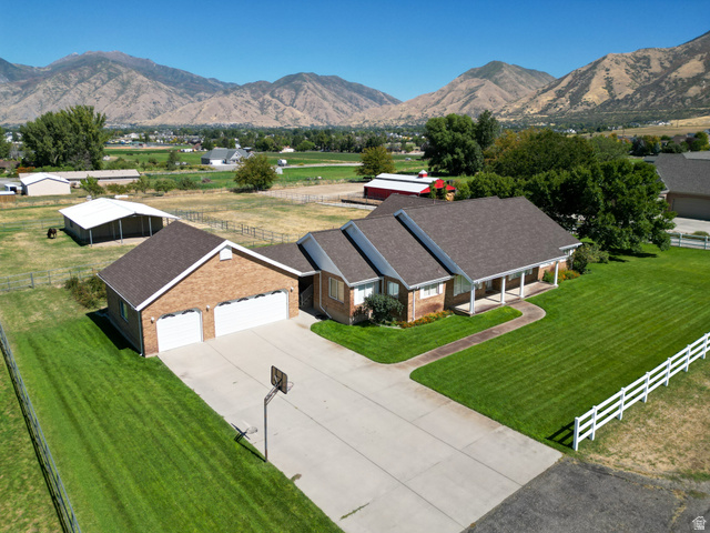 1060 West 2620th Street South Mapleton, UT 84664 - Photo 4 of 87 Drone / aerial view of a mountainous background