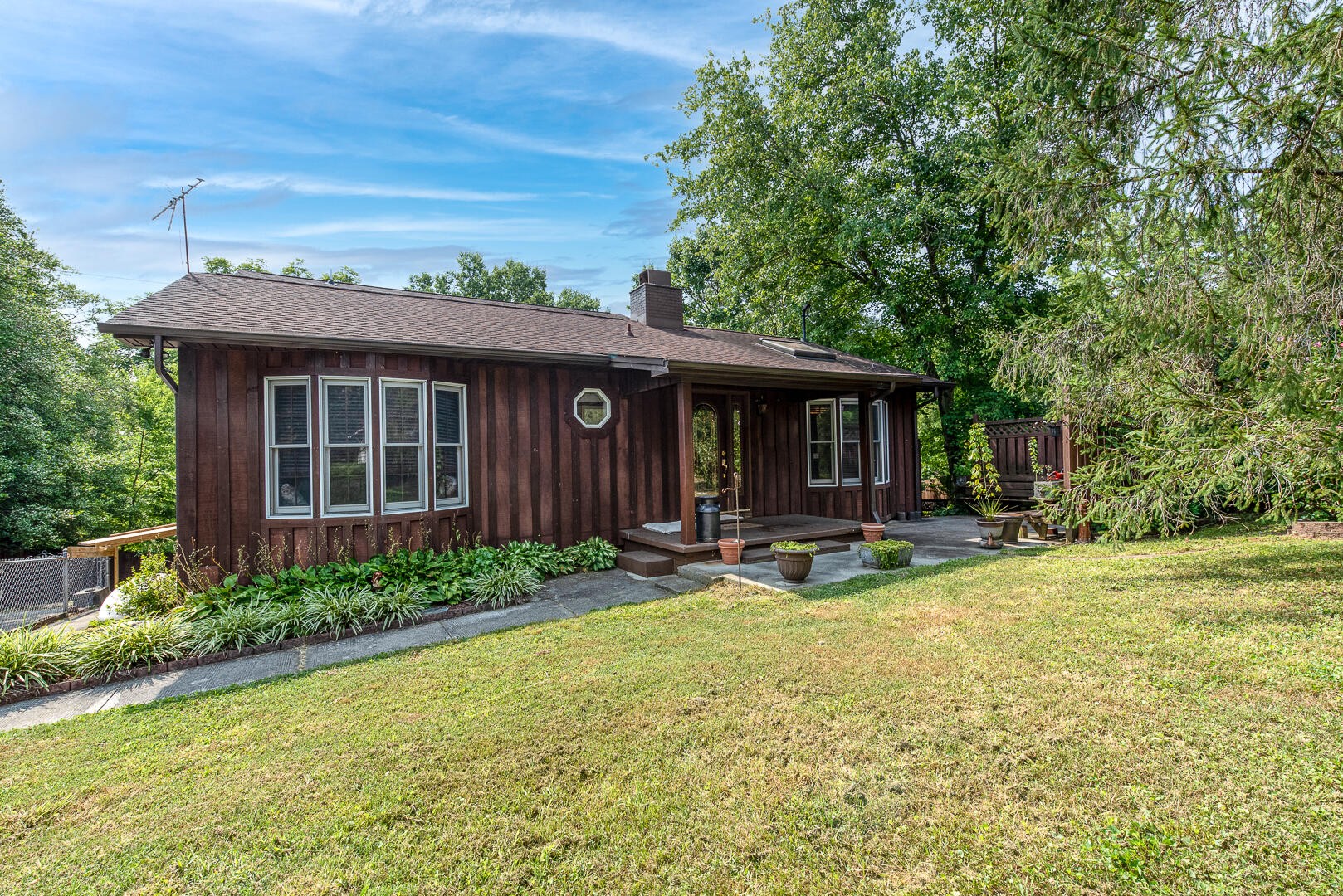 511 Delaware Avenue Oak Ridge, TN 37830 - Photo 1 of 37 a view of a house with backyard porch and sitting area