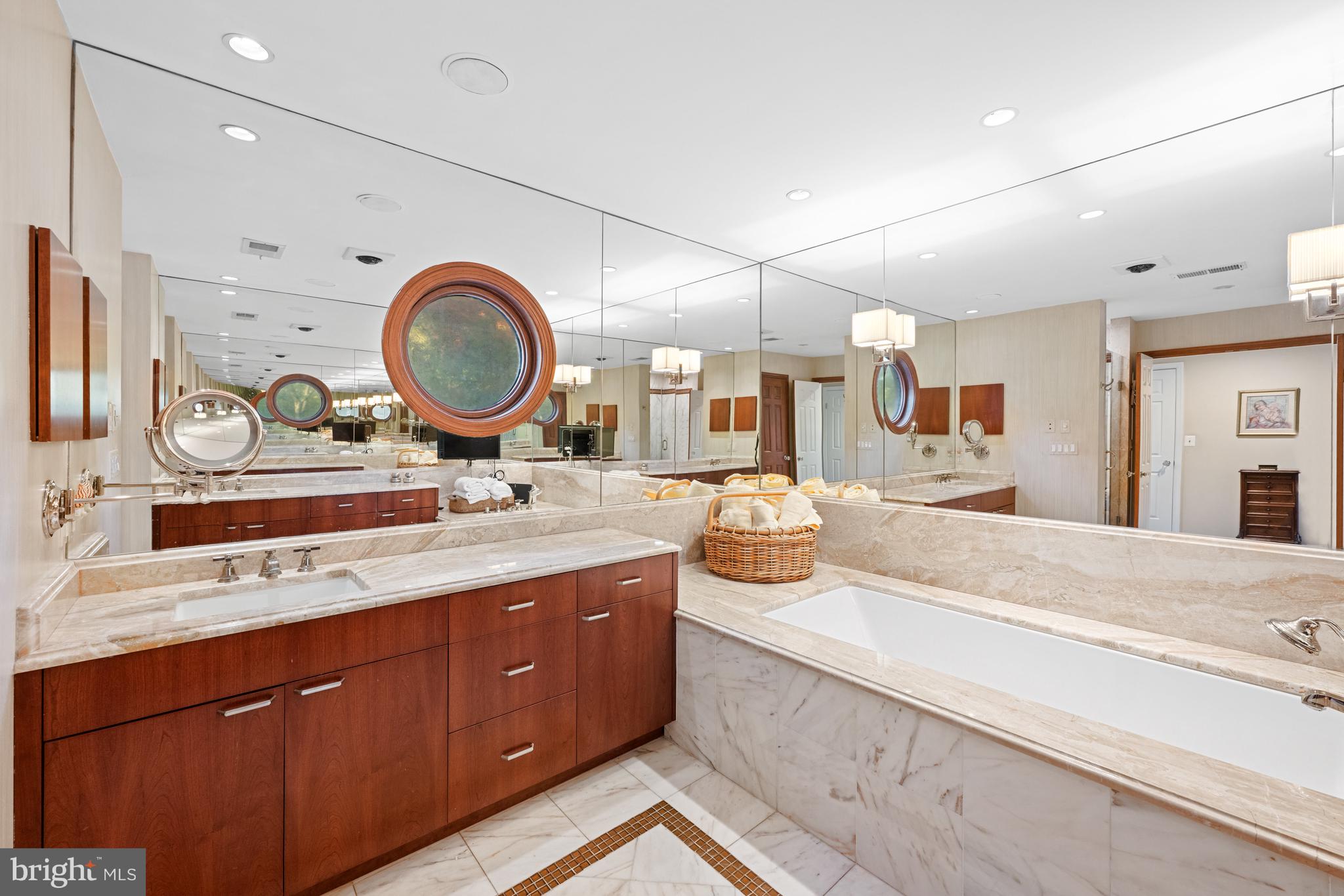 4616 Foxhall Crescent Northwest Washington, DC 20007 - Photo 13 of 21 a bathroom with a granite countertop sink and a mirror