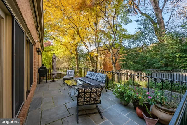 a view of two chairs in the balcony