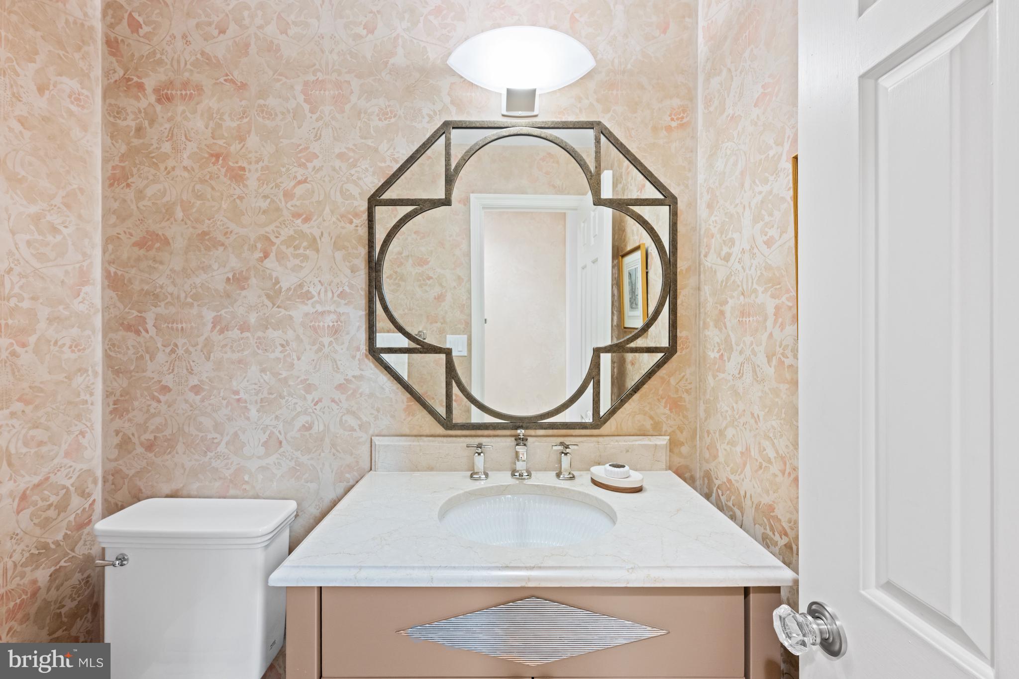 4616 Foxhall Crescent Northwest Washington, DC 20007 - Photo 8 of 21 a bathroom with a sink and a mirror