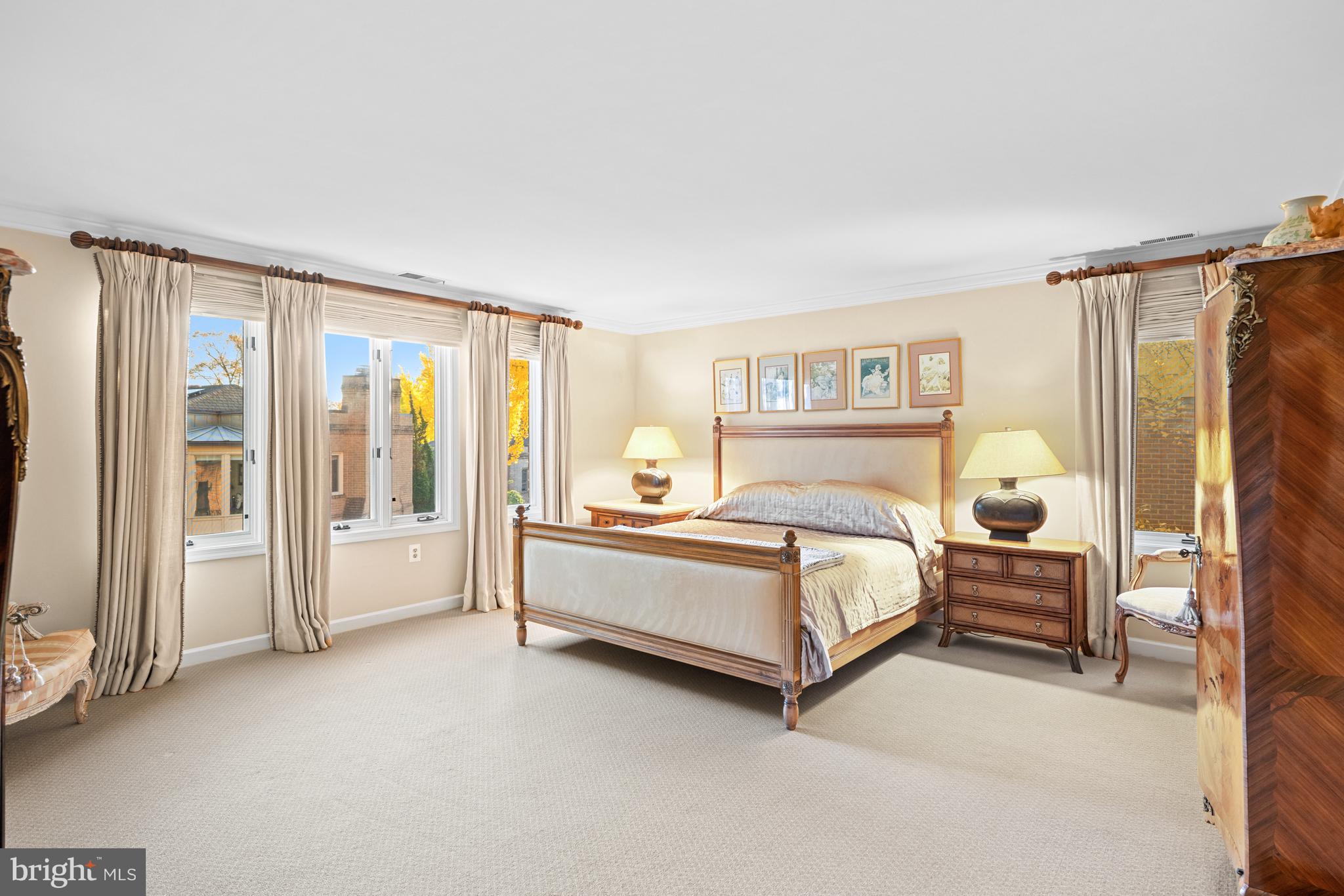 4616 Foxhall Crescent Northwest Washington, DC 20007 - Photo 10 of 21 a spacious bedroom with a bed and a large window
