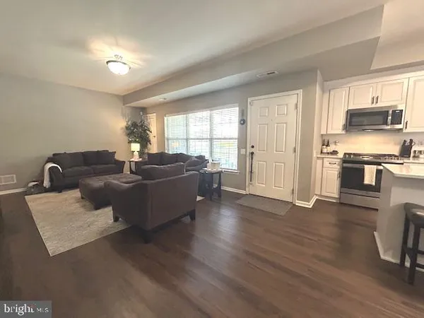 a bedroom with a bed and a television