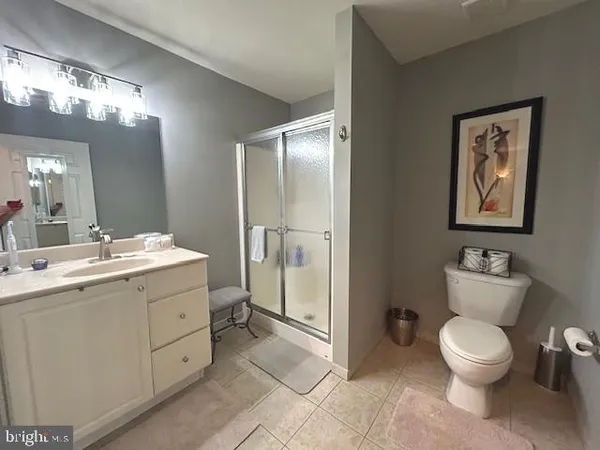 a utility room with dryer washer and stair
