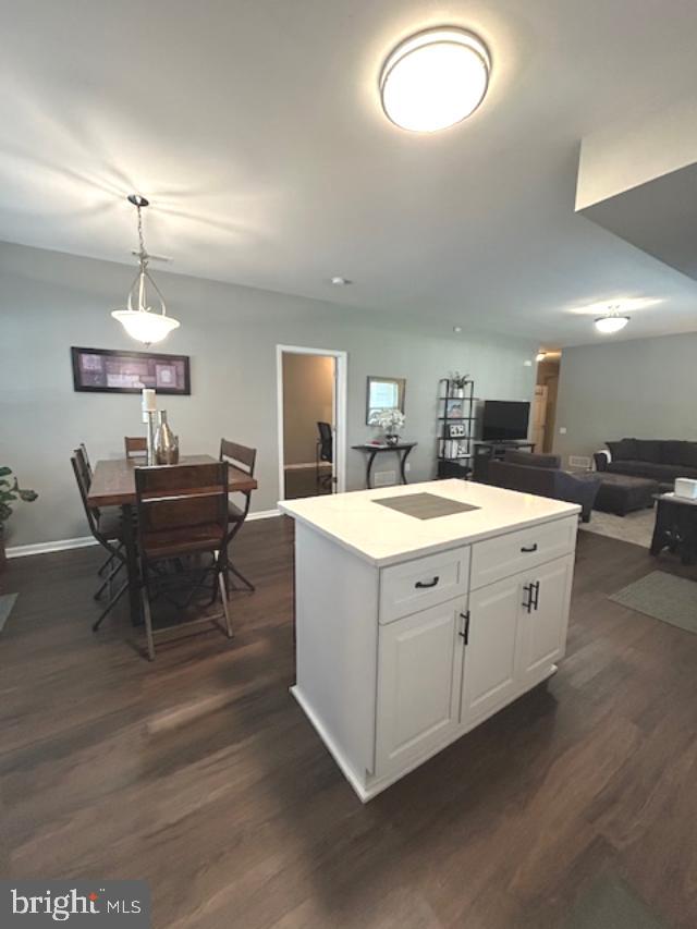 13675 Philmont Avenue, Unit 7 Philadelphia, PA 19116 - Photo 7 of 47 a large white kitchen with a sink and chandelier