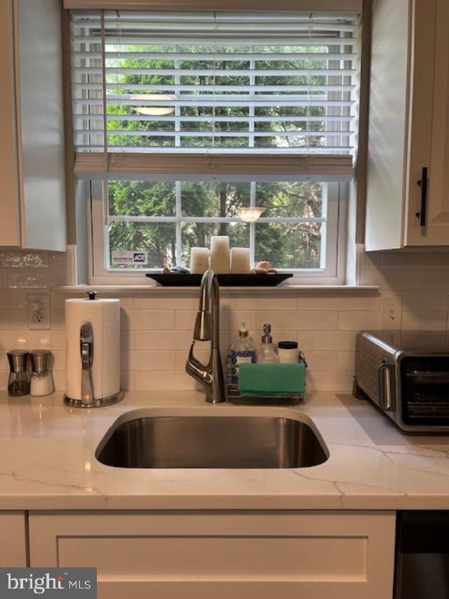 13675 Philmont Avenue, Unit 7 Philadelphia, PA 19116 - Photo 8 of 47 a kitchen sink with a glass table