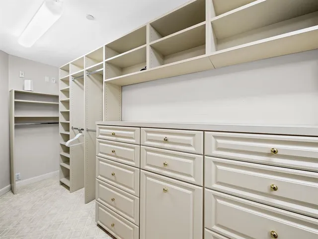 a view of an empty walk in closet