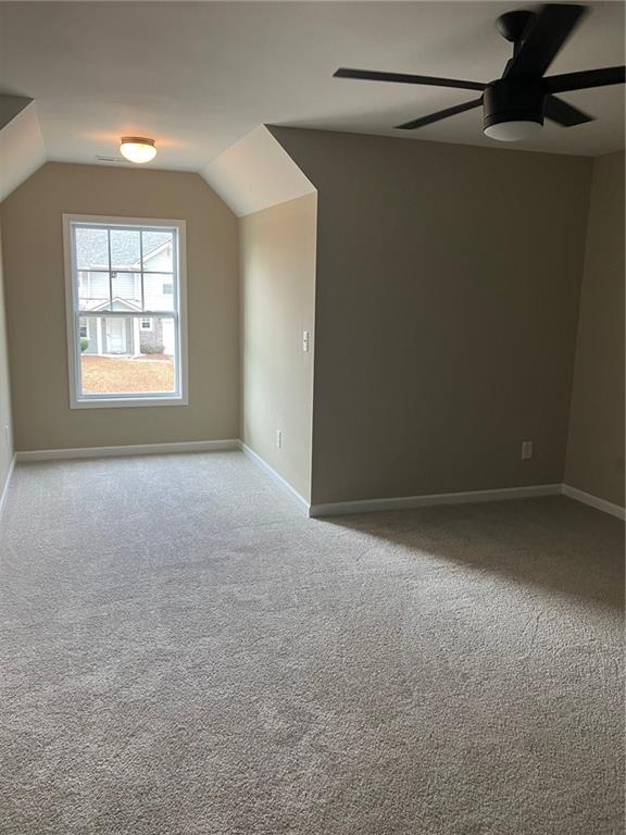 2808 Brookford Lane Southwest Atlanta, GA 30331 - Photo 12 of 25 a view of a big room with windows and chandelier fan