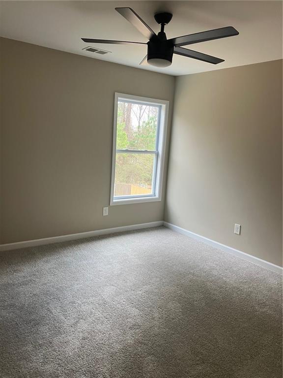 2808 Brookford Lane Southwest Atlanta, GA 30331 - Photo 17 of 25 a view of an empty room with a window
